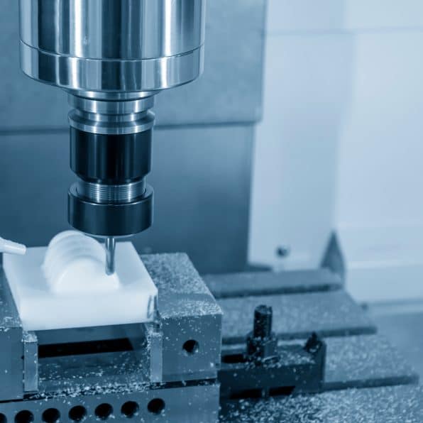 The CNC milling machine cutting the plastic parts with solid ball endmill tool. The hi-technology manufacturing processing by CNC machining center.